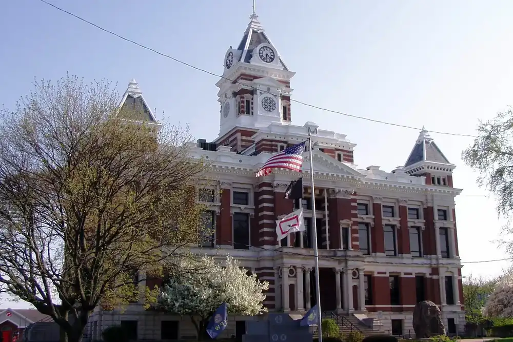 The Johnson County Courthouse clock tower and lawn on the square in downtown Franklin, Indiana
