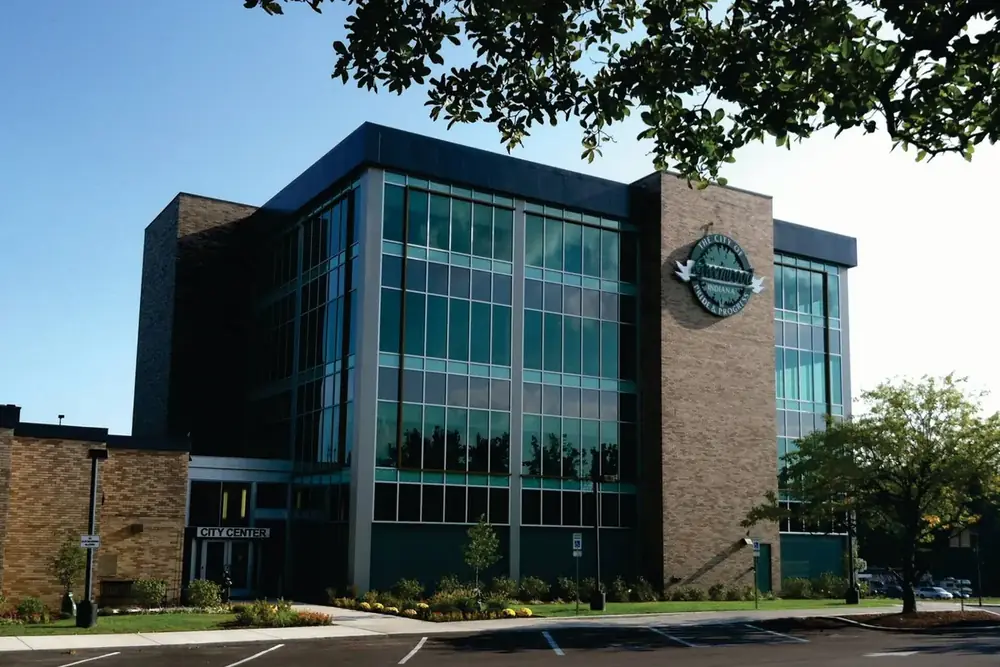Greenwood City Center, a glass and brick civic building behind a landscaped lawn in Greenwood, Indiana
